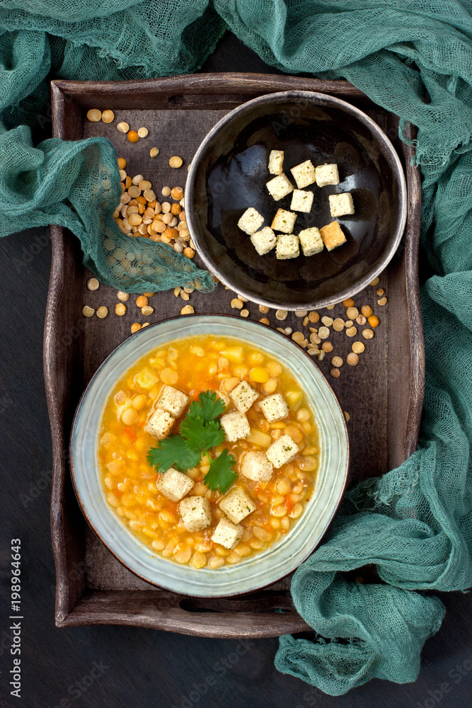 Yellow split pea soup with croutons and parsley