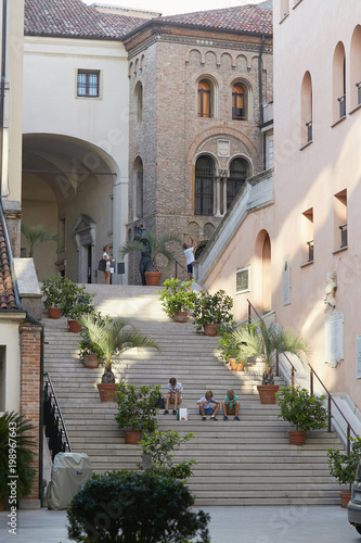 Padova, Italy - August 24, 2017: Statue of the Old Padua of the XVII century. Palazzo Moroni Seat Padua City Hall: Courtyard interior.