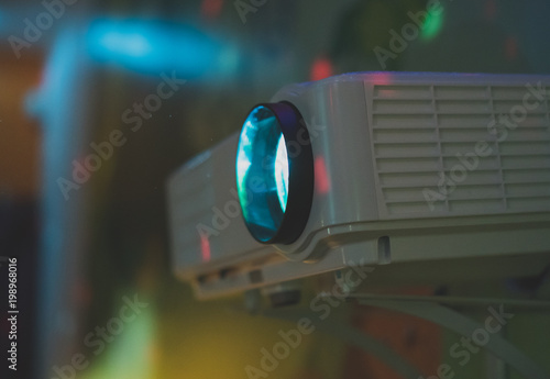 Movie projector in action mounted on the wall.