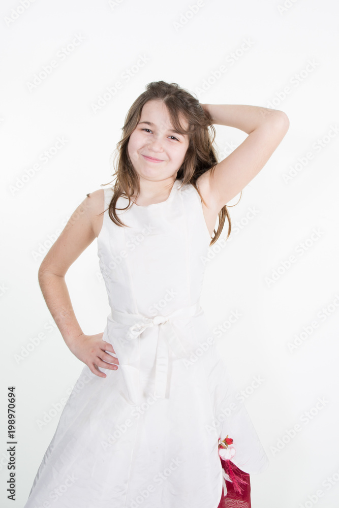 Close-up portrait of adorable smiling child girl wearing white dress Close-up portrait of adorable smiling child girl wearing white dress