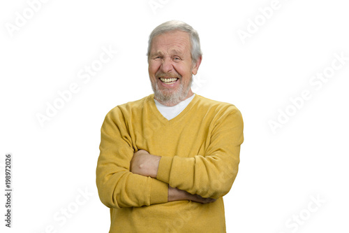 Portrait of happy grandpa with arms crossed. Laughing old senior man. White isolated background. © DenisProduction.com