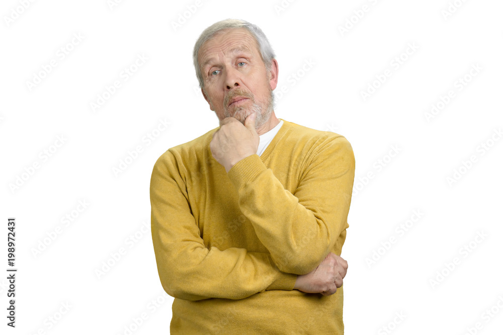 Pensive old man portrait. Nice handsome senior serious grandpa in yellow sweater. White isolated background. Pensive old man portrait. Nice handsome senior serious grandpa in yellow sweater. White isolated background.