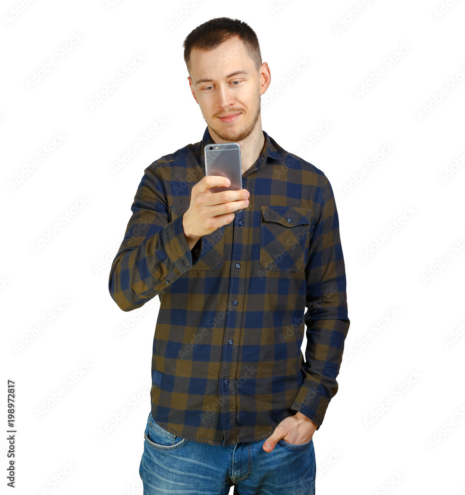 young man in a checkered shirt uses a mobile phone, casual clothes, isolated on white background young man in a checkered shirt uses a mobile phone, casual clothes, isolated on white background