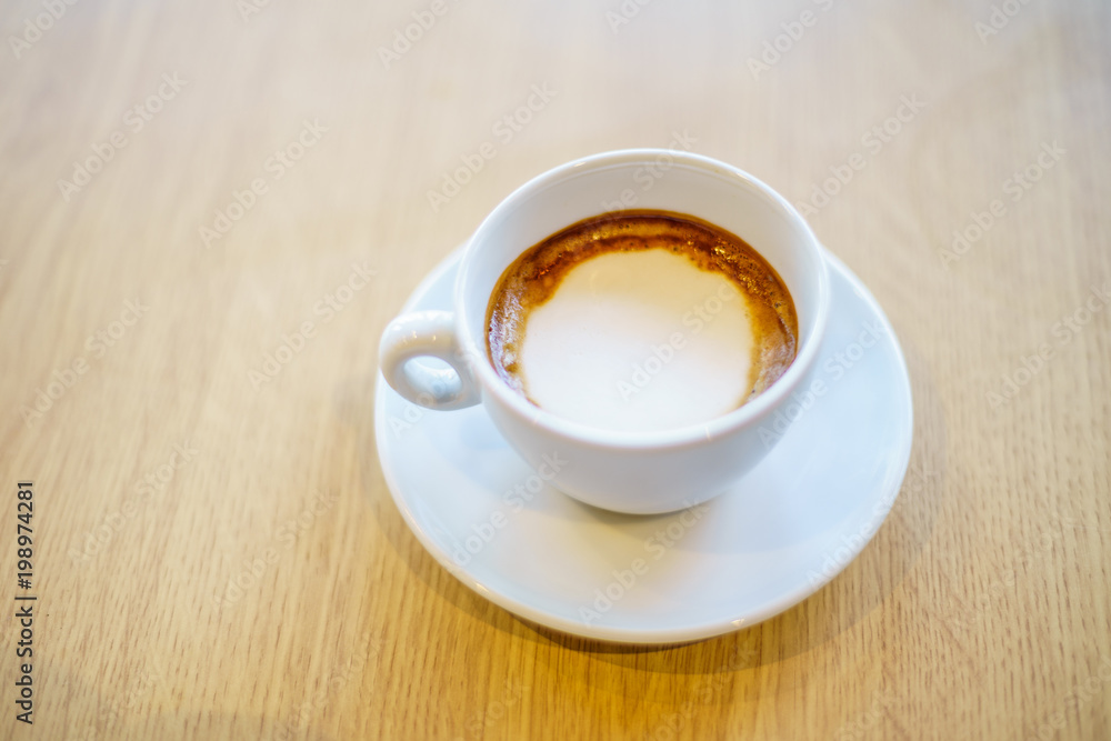 Americano Caffe with wooden background Americano Caffe with wooden background