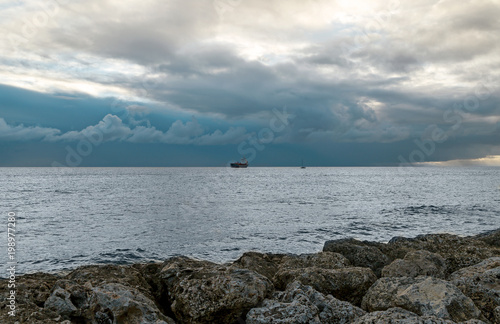 The ocean before the storm with blue clouds 