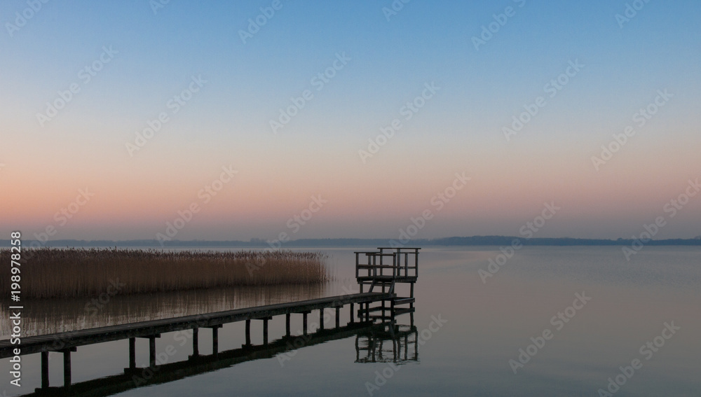 Panorama, footbridge, and quiet scene on the lake in the north, Germany