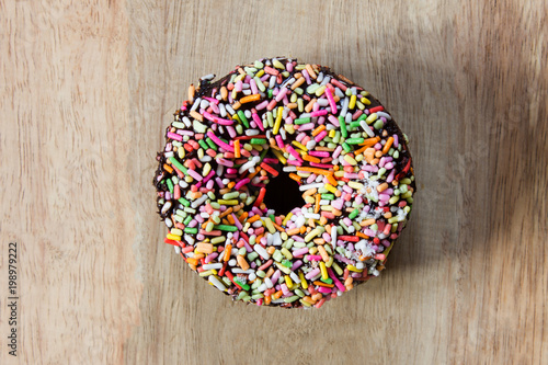 Donuts on a wooden background. Free space for text. Top view.