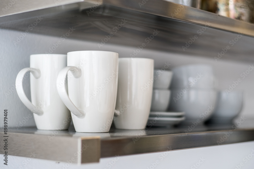 Ceramic bowls and mugs on shelf Ceramic bowls and mugs on shelf