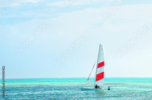 Windsurfing board against the azure water of the Indian Ocean, Maldives
