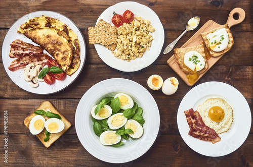 different various of eggs over rustic background