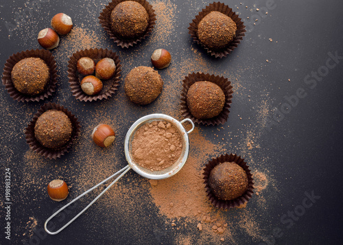 small chocolate petit fours with hazelnuts top view photo