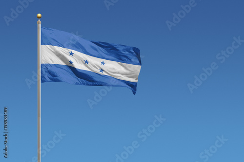 Honduras Flag in front of a clear blue sky