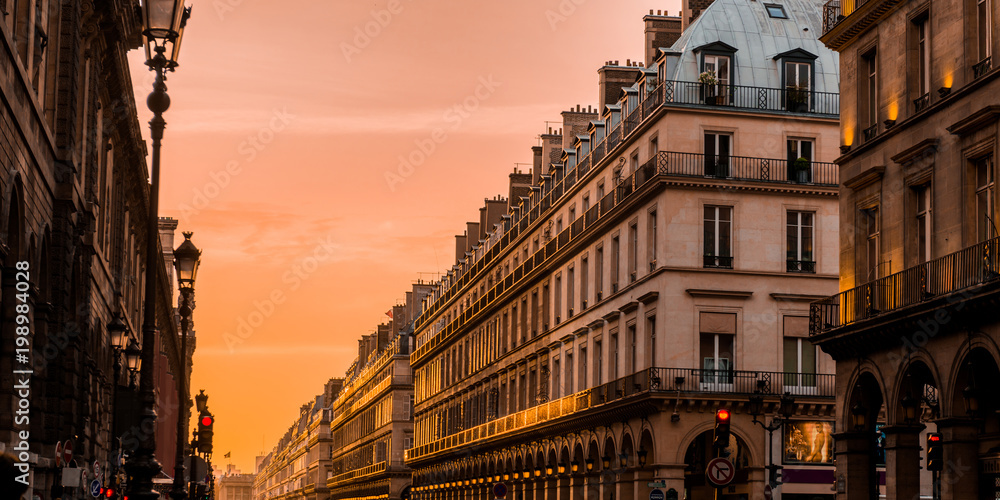 Sunset in Paris, street with its building in corridor