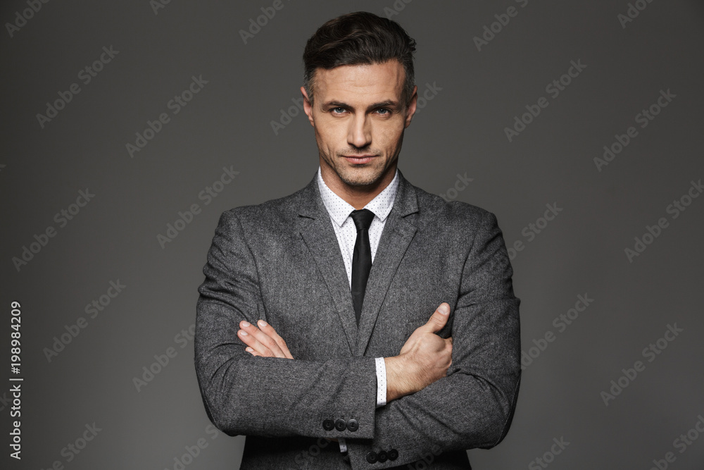 Ταπετσαρία Image of mature unshaved man wearing business suit looking on camera with strict
