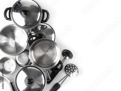Set of stainless steel pot with kitchen tool set on white background,top view