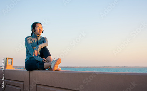 Girl enjoying time outside and listening to music with headphones