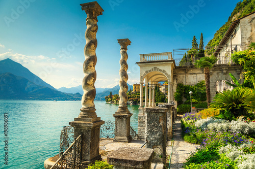 Fototapeta Mediterranean flowers and villa Monastero in background, lake Como, Varenna