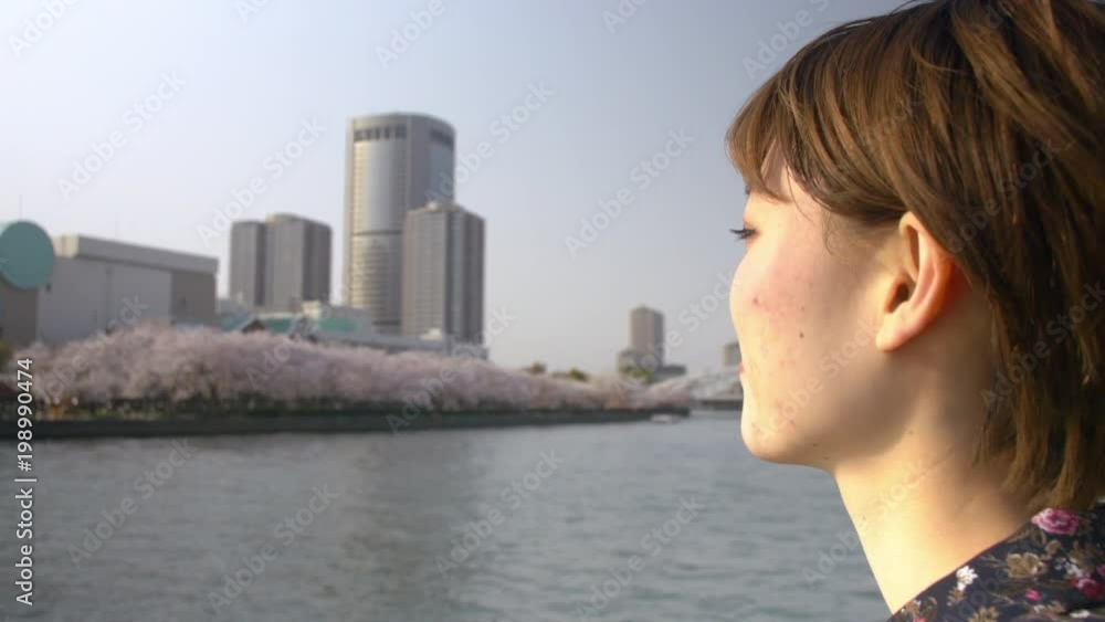 Japanese woman posing by a beautiful river. Japanese woman posing by a beautiful river.