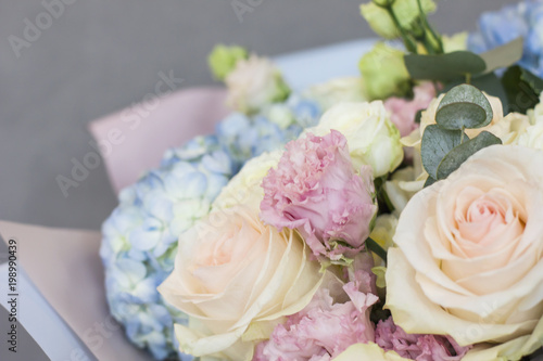 The delicate rustic floral bouquet on grey background