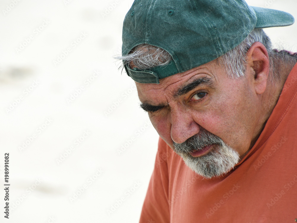 elderly Lebanese man with gray mustache and goatee wearing baseball cap  backwards Stock Photo | Adobe Stock