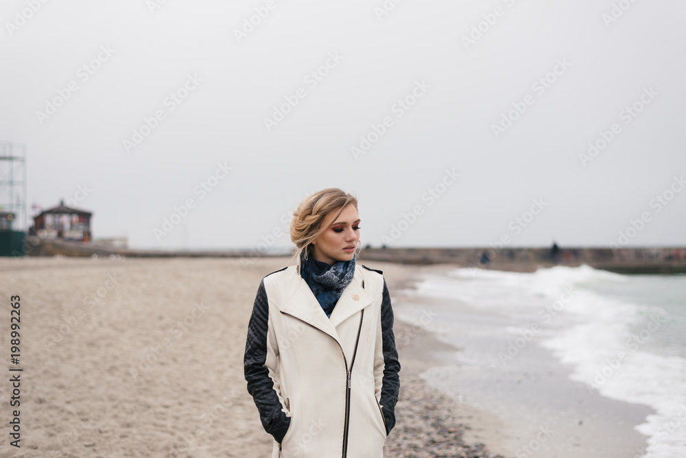 the blonde on the beach pondered and tilted her head the blonde on the beach pondered and tilted her head