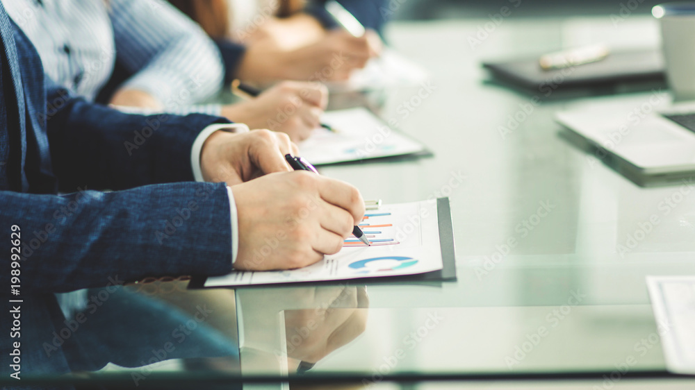 business team is working with financial documents at workplace in the office business team is working with financial documents at workplace in the office