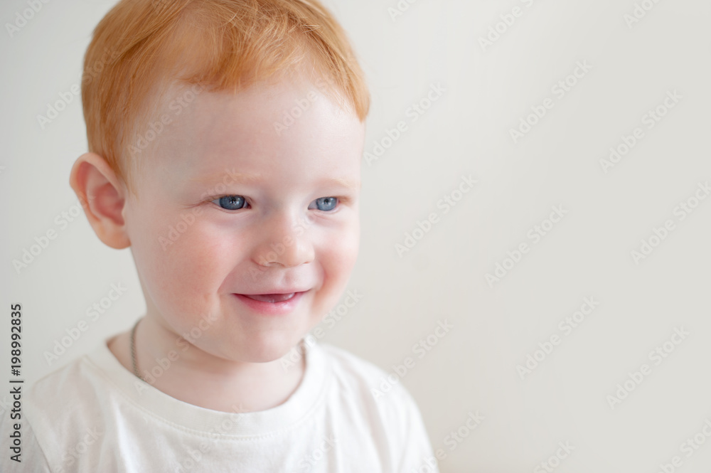 Smiling redhead boy on the white background Smiling redhead boy on the white background