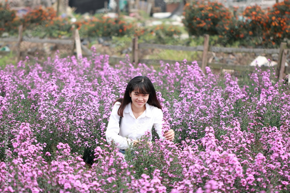 woman at the flower garden in Hanoi, Vietnam woman at the flower garden in Hanoi, Vietnam