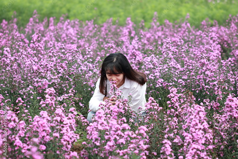 woman at the flower garden in Hanoi, Vietnam woman at the flower garden in Hanoi, Vietnam