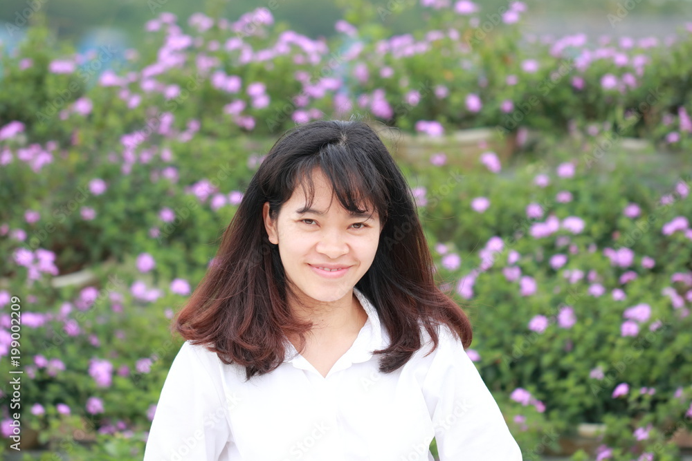 woman at the flower garden in Hanoi, Vietnam woman at the flower garden in Hanoi, Vietnam
