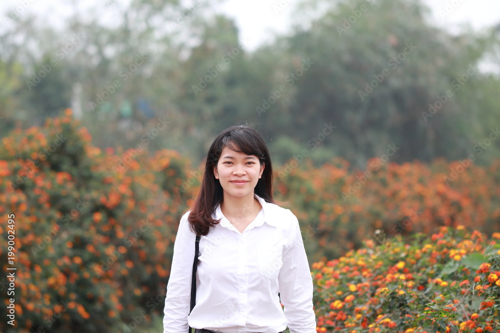woman at the flower garden in Hanoi, Vietnam woman at the flower garden in Hanoi, Vietnam