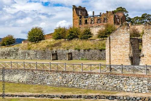 Scenic view and details of old buildings Port Arthur, Tasmania, Australia. Ruins of prison, World Heritage Site, cloudy sky in background.