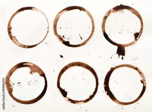 Collection of dry coffee cup stains on white background