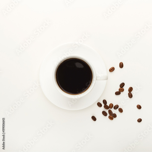 Black coffee cup and roasted beans isolated on white