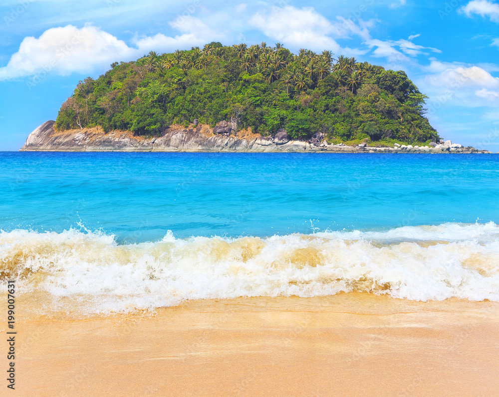 Picturesque view of Andaman sea with strong and high waves in Phuket island, Thailand. Seascape with yellow sand and blue sky. Tropical beach at the exotic island. Picturesque view of Andaman sea with strong and high waves in Phuket island, Thailand. Seascape with yellow sand and blue sky. Tropical beach at the exotic island.