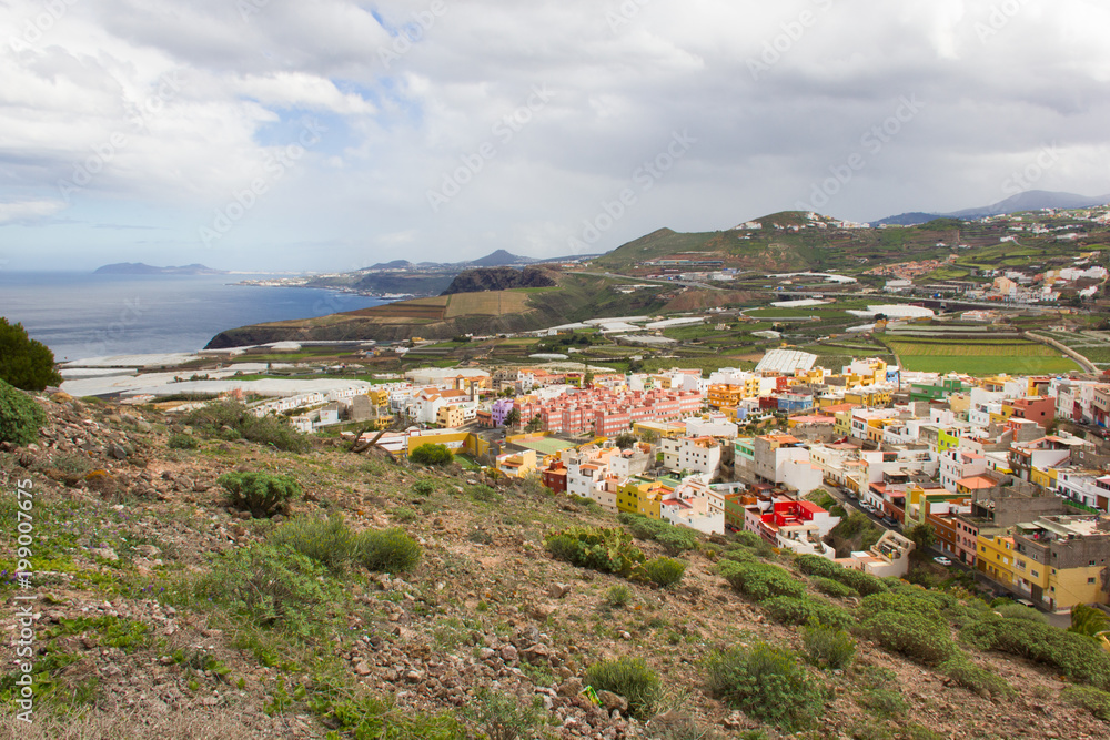 Scenic top views of Santa Maria de Guia town from Atalayita mountain in Gran Canaria on cloudy day. Panorama of Canary Islands
