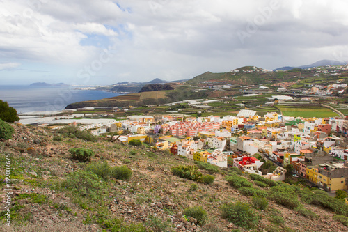 Scenic top views of Santa Maria de Guia town from Atalayita mountain in Gran Canaria on cloudy day. Panorama of Canary Islands