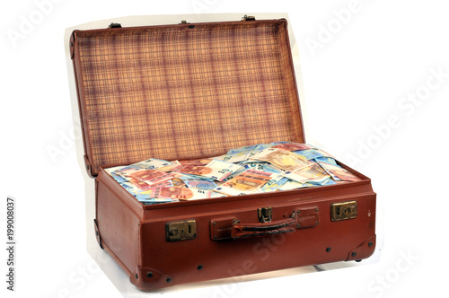 Valise pleine de billets de banque photo