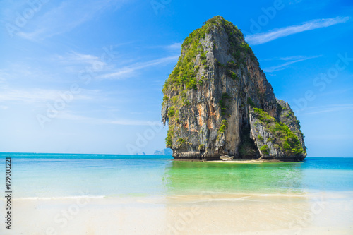 White sand, blue water beach with mountain at Phra Nang Cave beach in Krabi, Thailand