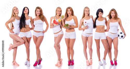 Fitness women. Three young beautiful girlfriends in white sportswear © Andrey_Arkusha