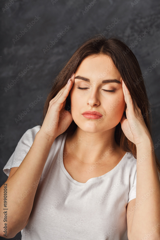 Portrait of young woman having headache Portrait of young woman having headache