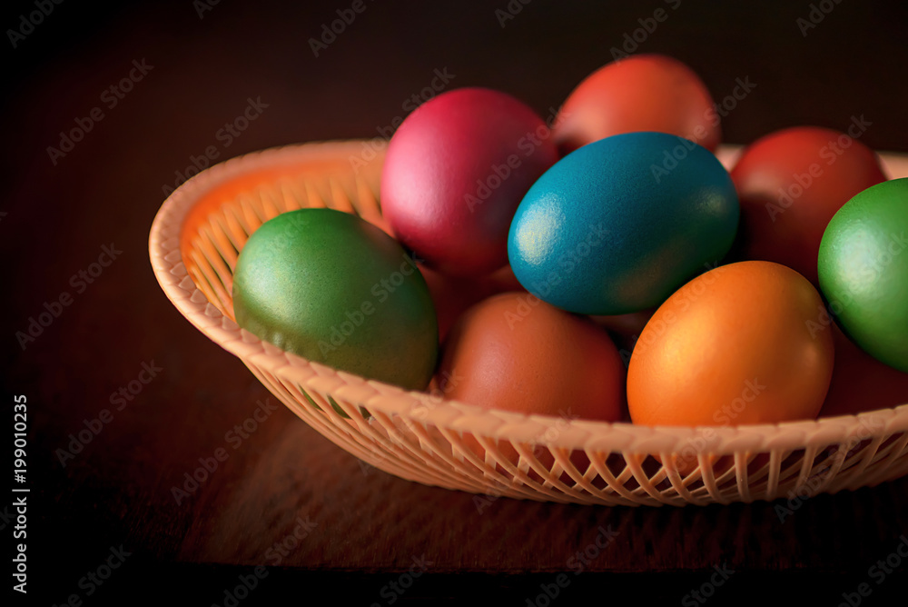 Painted multi-colored paint Easter eggs with a basket