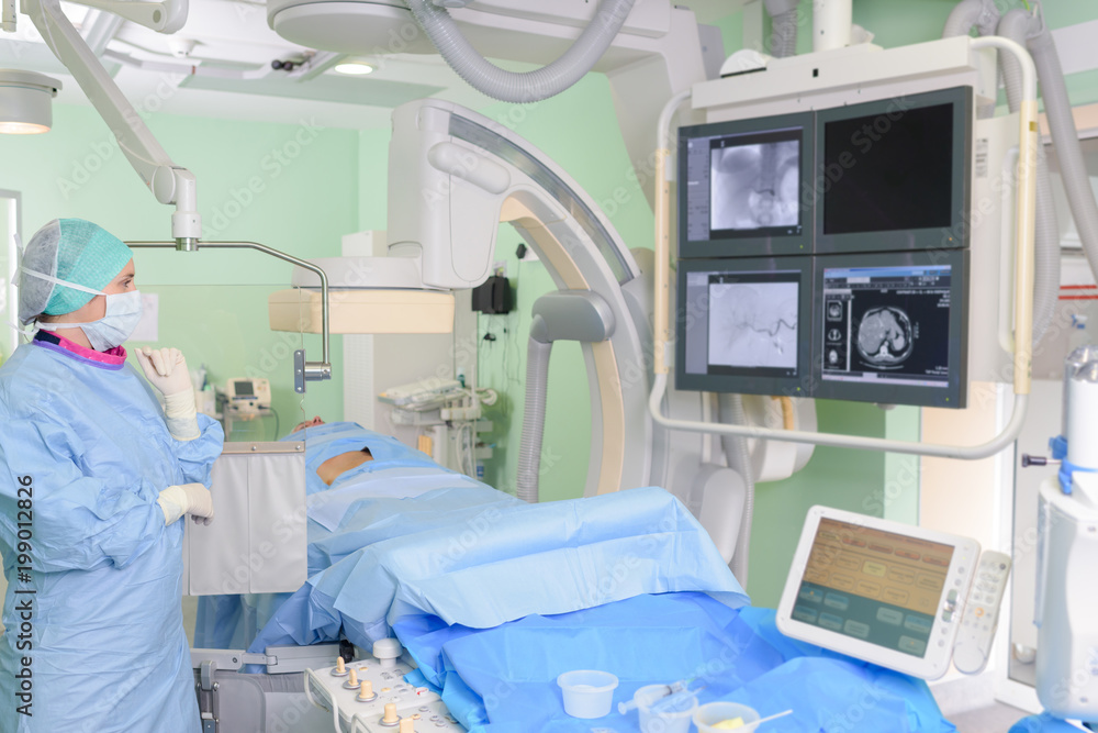 Riologist looking at xray screens Riologist looking at xray screens