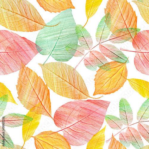 A seamless background pattern with green and golden yellow leaves