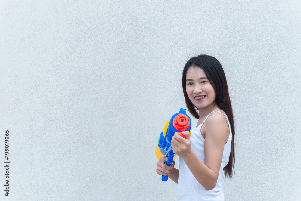 Asian sexy woman with water in hand on white background,Festival songkran day at thailand,The best of festival of thai,Land of smile Asian sexy woman with water in hand on white background,Festival songkran day at thailand,The best of festival of thai,Land of smile