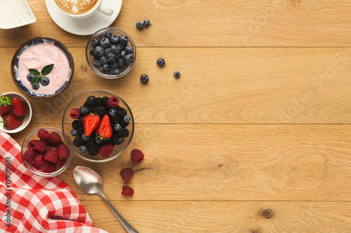 Rich breakfast on natural wooden table