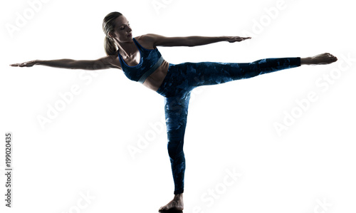 one caucasian woman exercising fitness Yoga excercises in silhouette isolated on white background