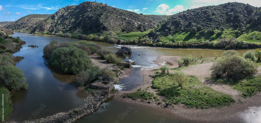 Aerial view Guadiana river with the old traditional watermills at Azenhas Mertola. Alentejo, Portugal