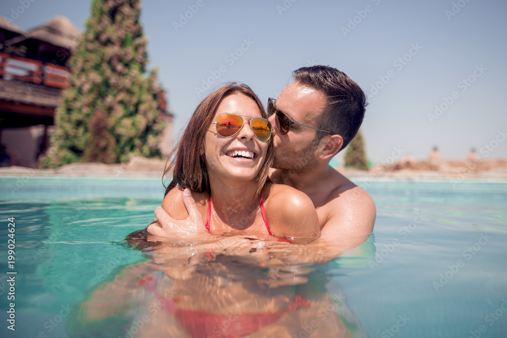 Couple having fun in swimming pool