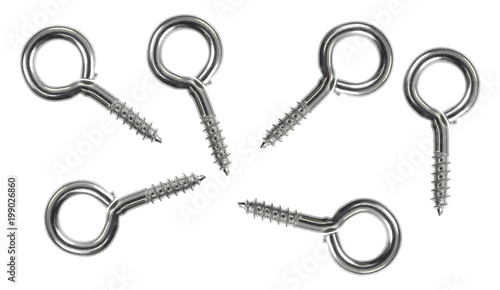 Top view of a group of stainless steel screw eyes with a lag thread isolated on a white background.